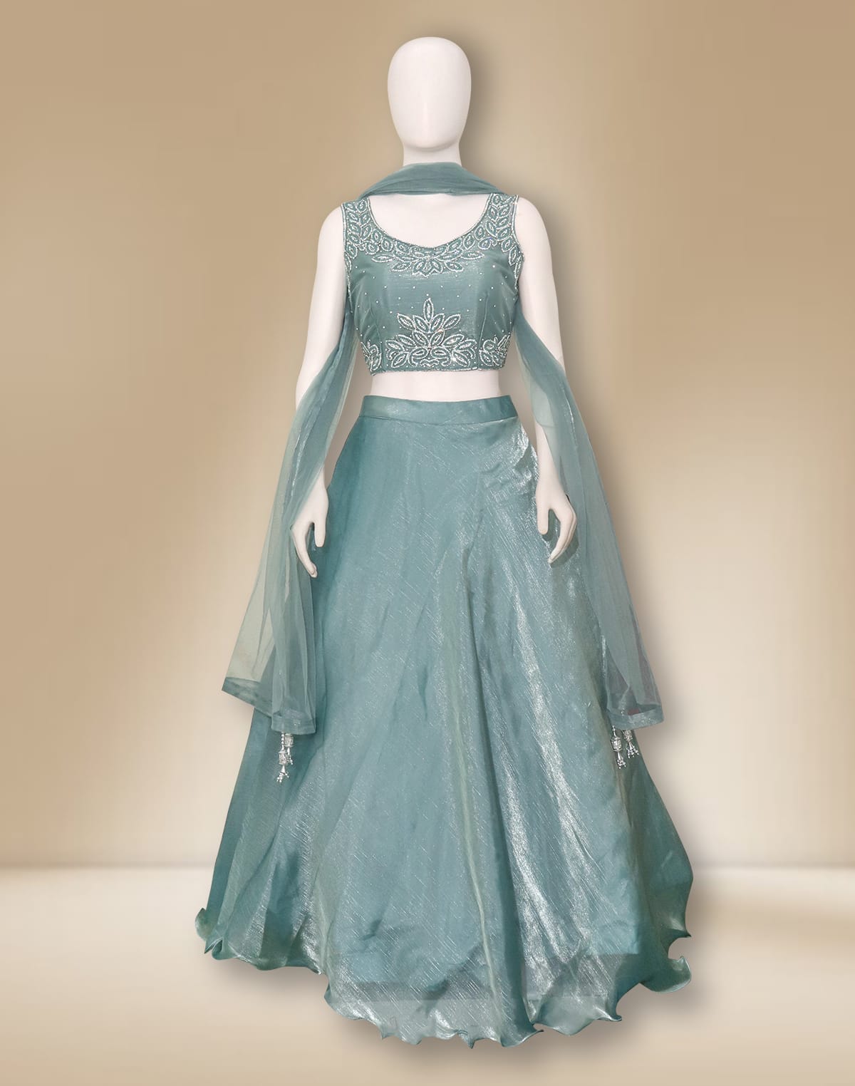 Collection of Elegant Sea Green Netted Stones work Crop Top and Lehenga Set in a gallery layout