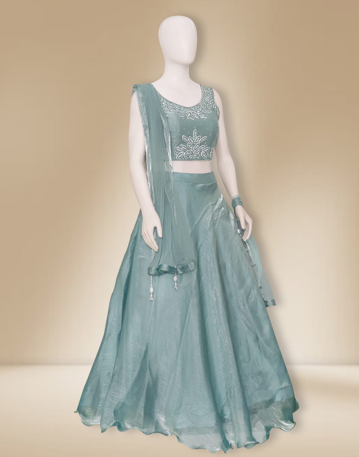 Collection of Elegant Sea Green Netted Stones work Crop Top and Lehenga Set in a gallery layout