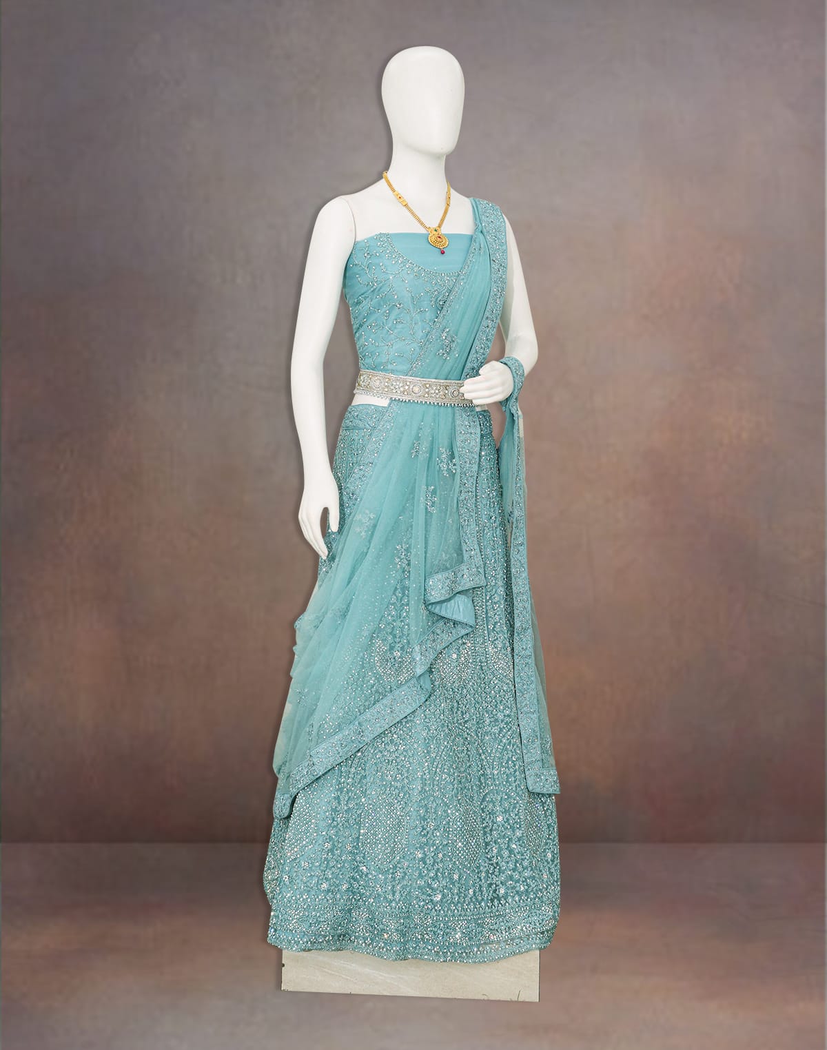 Collection of Elegant party wear Sea Green Stones with Embroidery work fully flared Netted lehenga set in a gallery layout