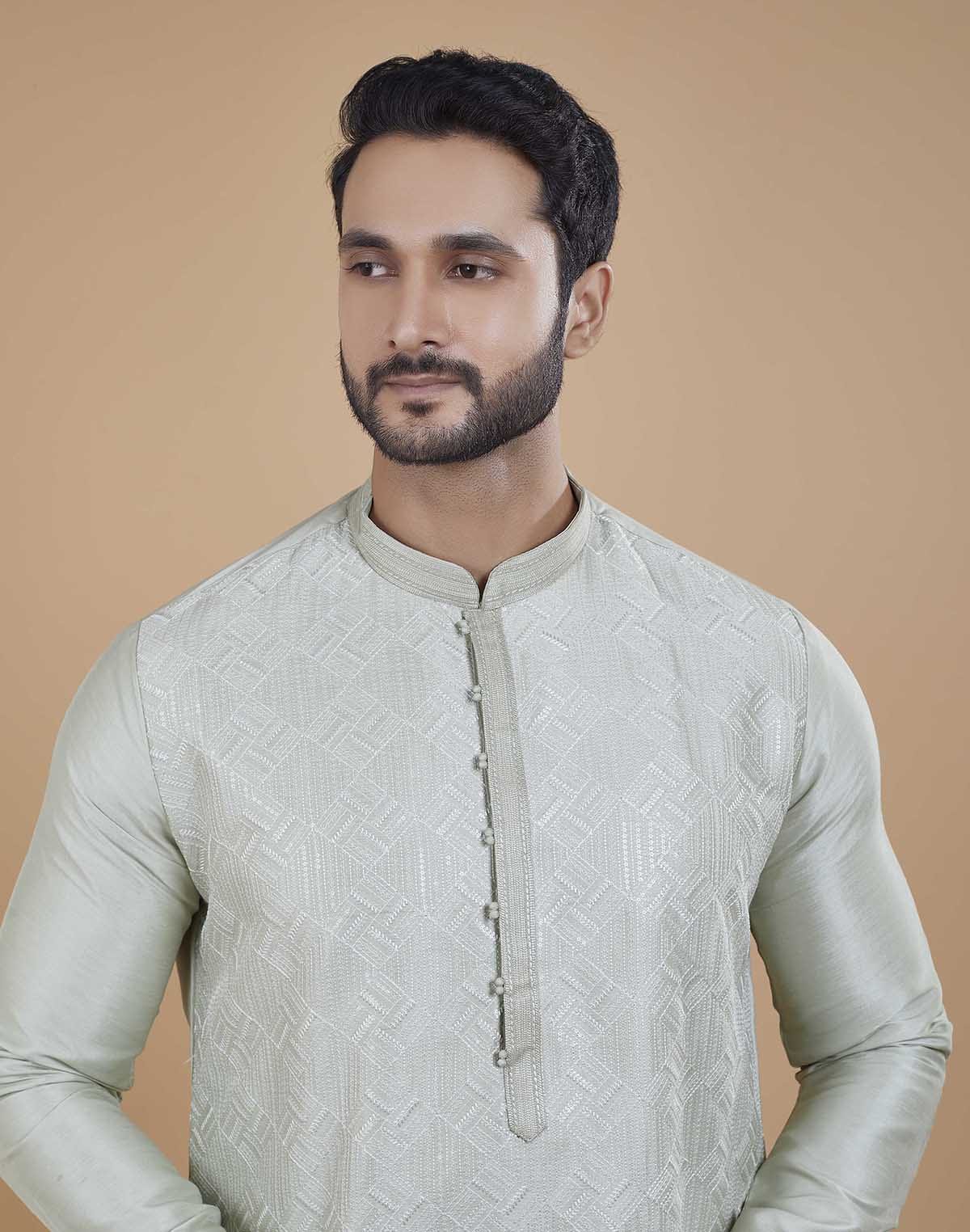 Collection of Soft Silk Self Design Pattern Kurta Set in a gallery layout