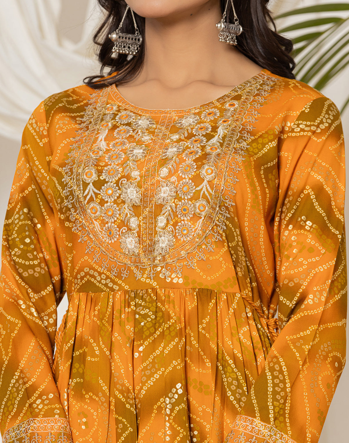 Collection of Mustard Rayon Bandhini Print Kurti in Round Neck in a gallery layout