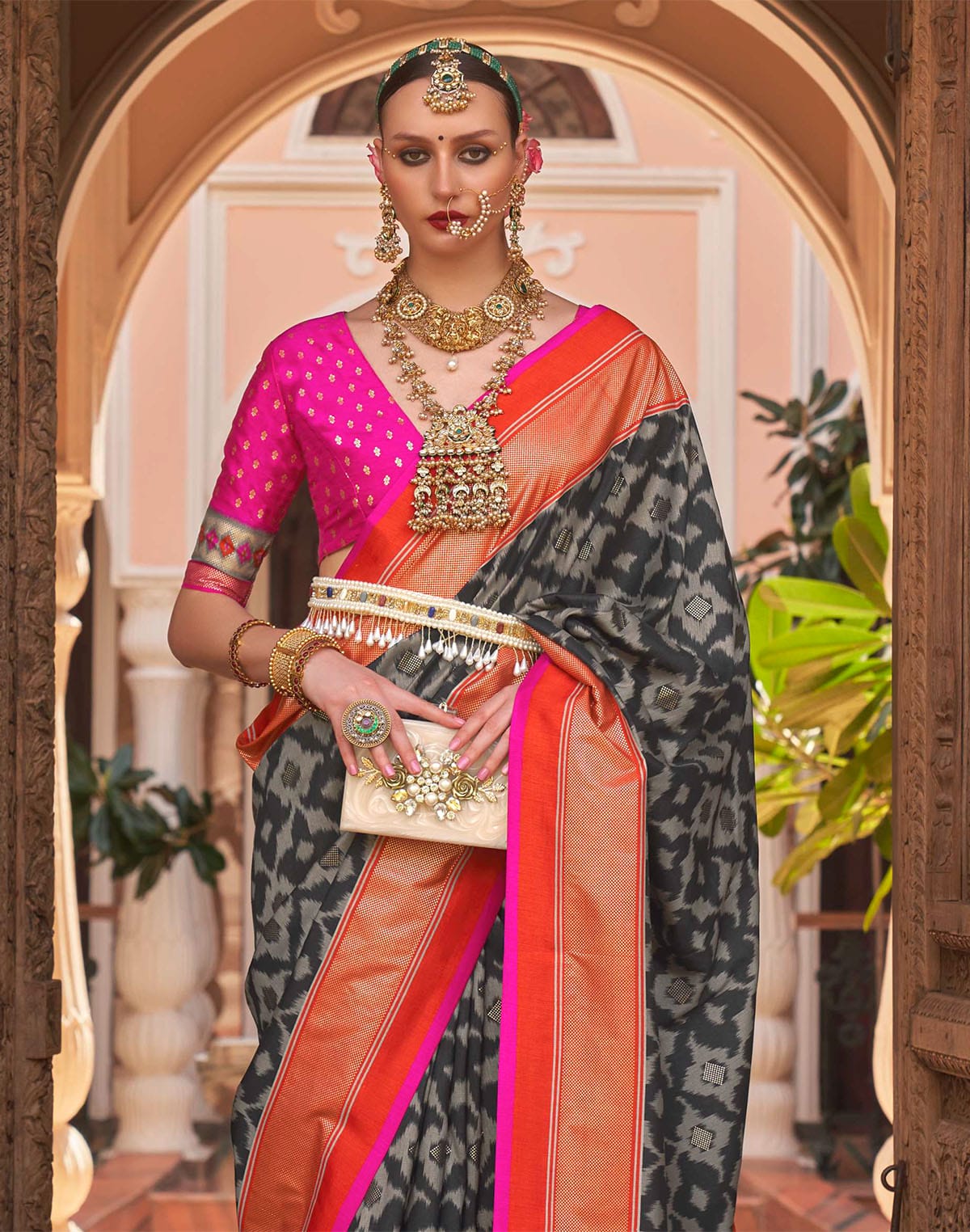 Collection of Black Graphic Print Patola Silk Saree in a gallery layout