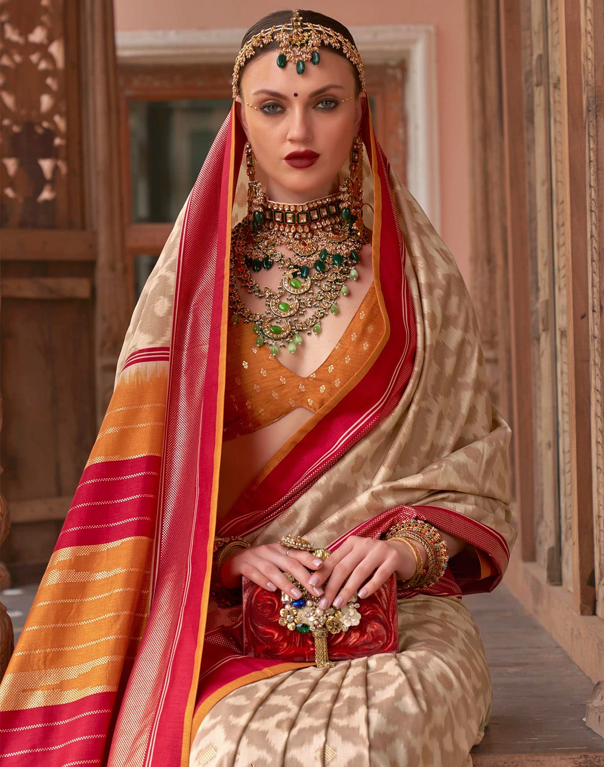 Collection of Beige Colour smooth Patola Silk Saree in a gallery layout