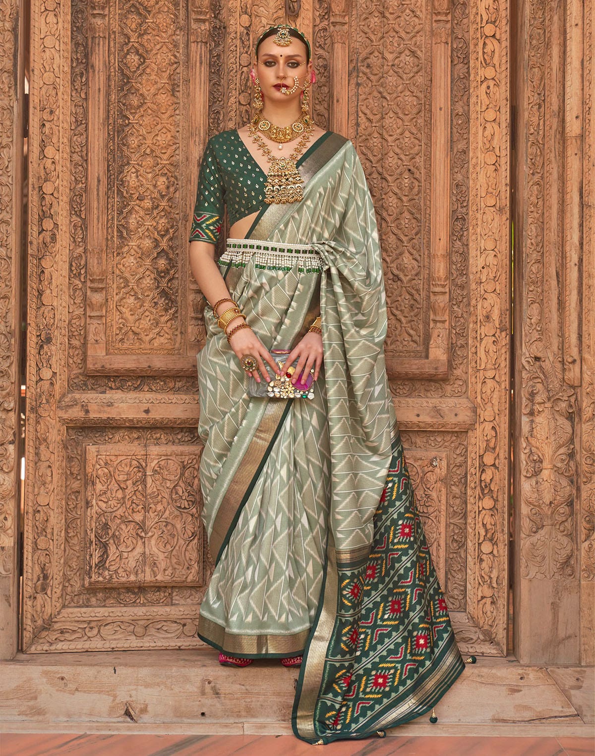 Collection of Light Green Geometric Print Patola Designer Saree in a gallery layout