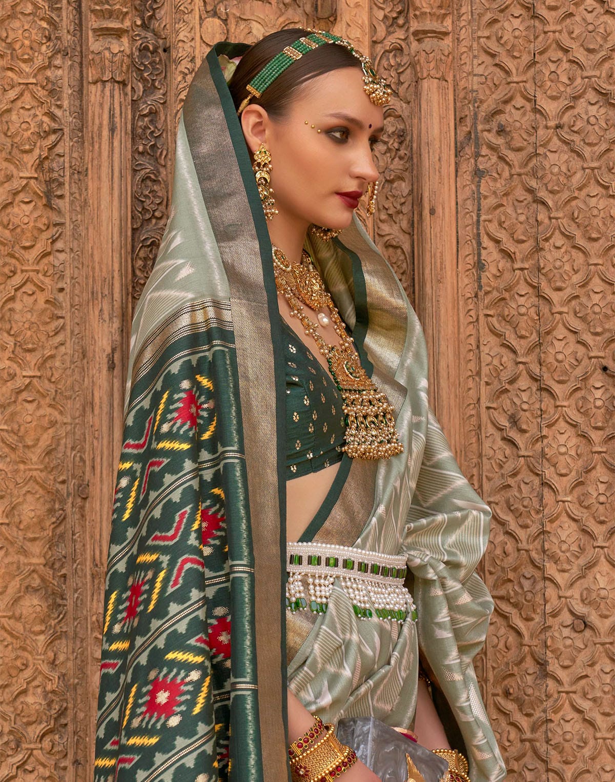 Collection of Light Green Geometric Print Patola Designer Saree in a gallery layout