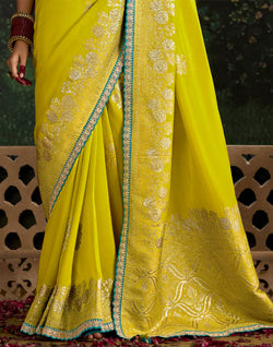 Collection of Lemon Yellow Fancy Lace Border Pure Dola Silk Saree With Embroidery Work Blouse in a gallery layout