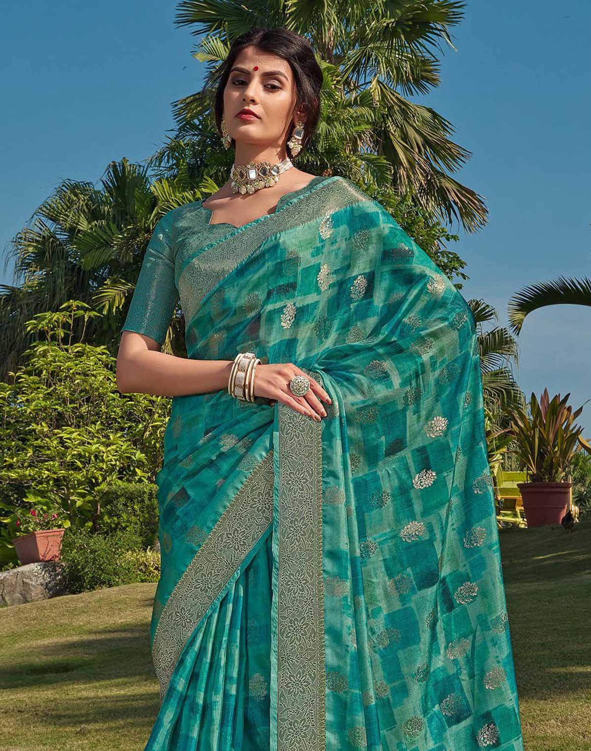 Collection of Sea Green Floral bunches Soft Silk Saree in a gallery layout