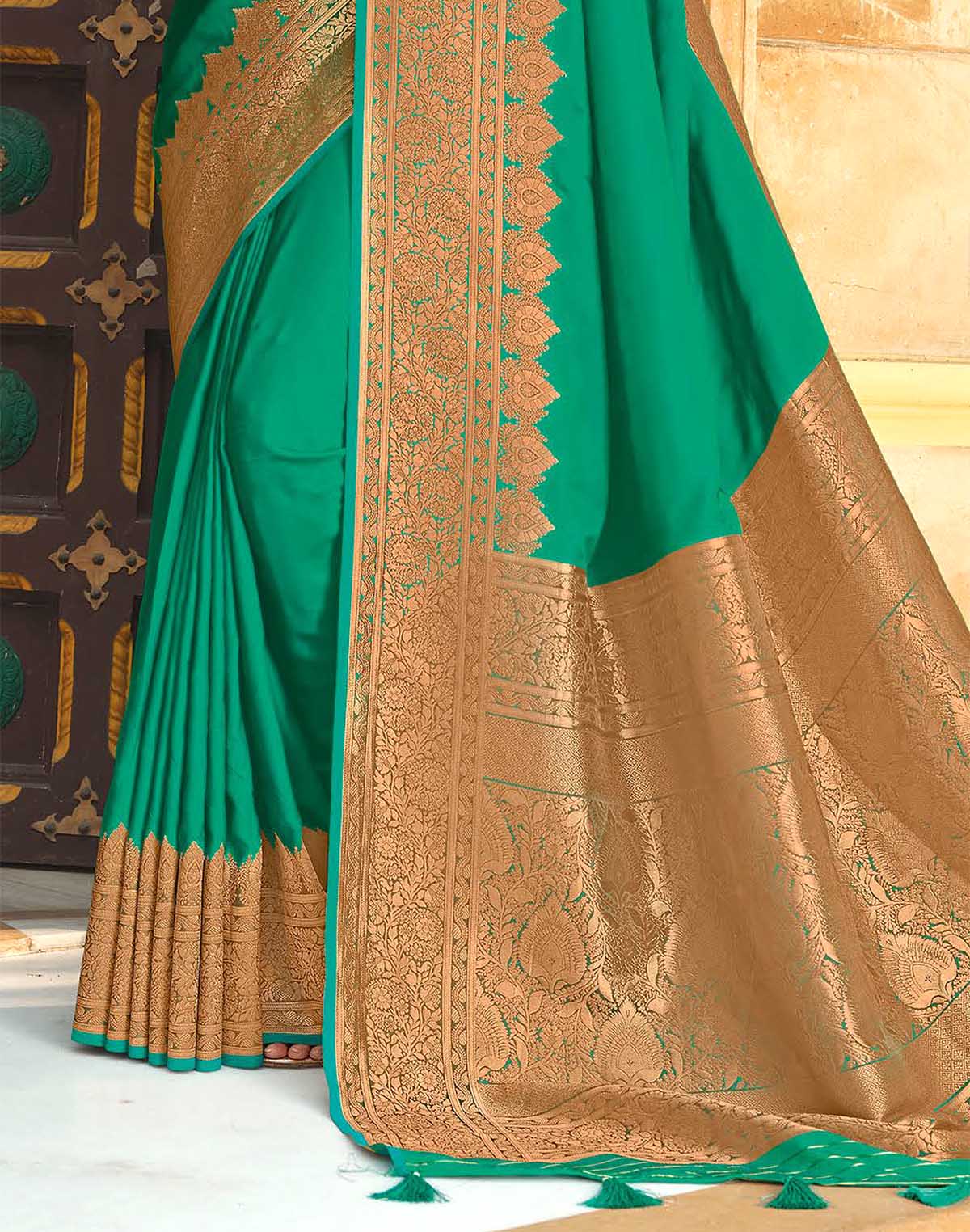 Collection of Sea Green Satin Silk Saree with Golden Heavy Border in a gallery layout