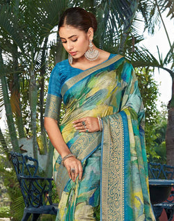 Collection of Teal Blue Graphic Print Party Wear Dola Silk Saree in a gallery layout