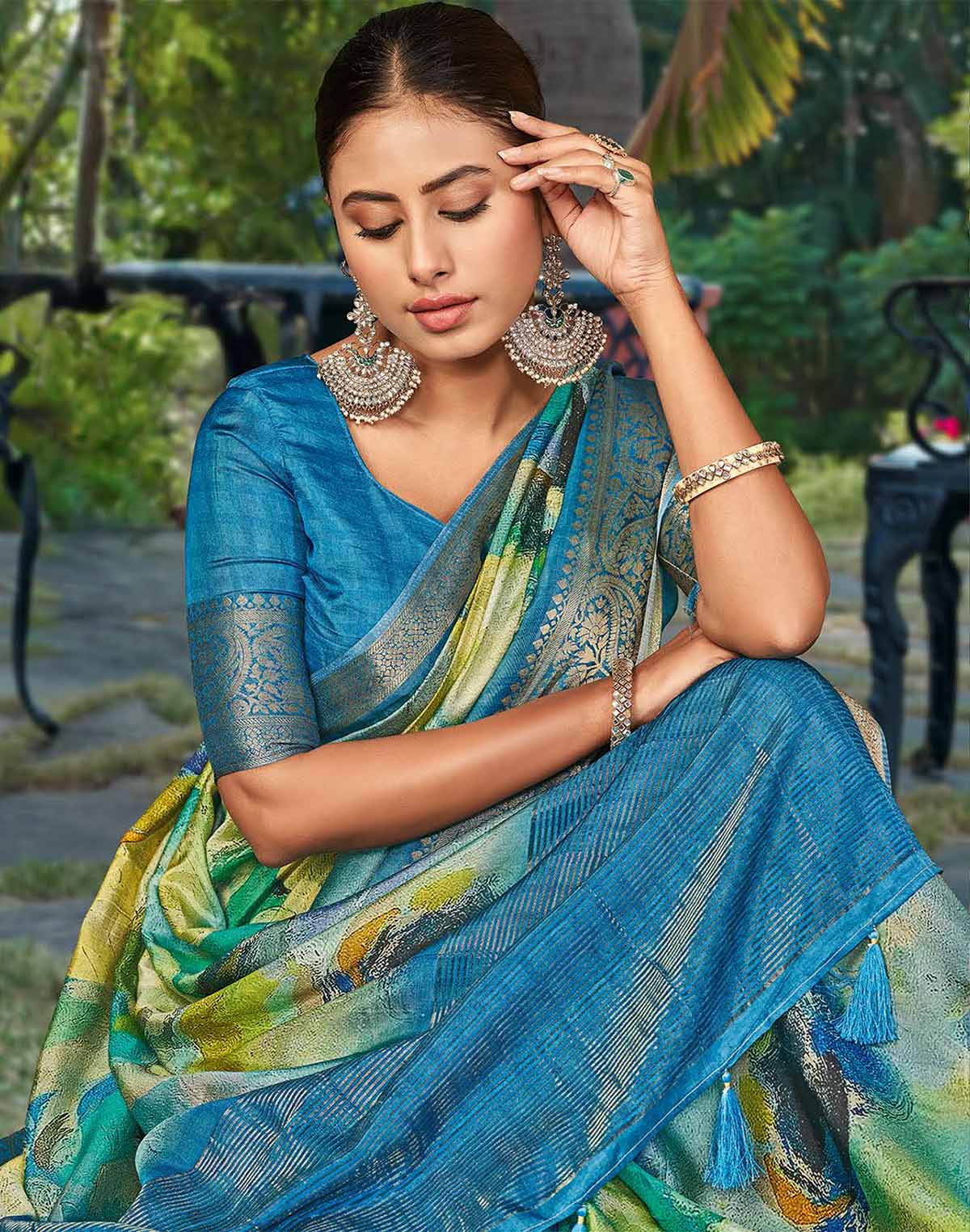 Collection of Teal Blue Graphic Print Party Wear Dola Silk Saree in a gallery layout