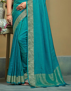 Collection of Sky Blue Raw Silk Plain Saree in a gallery layout