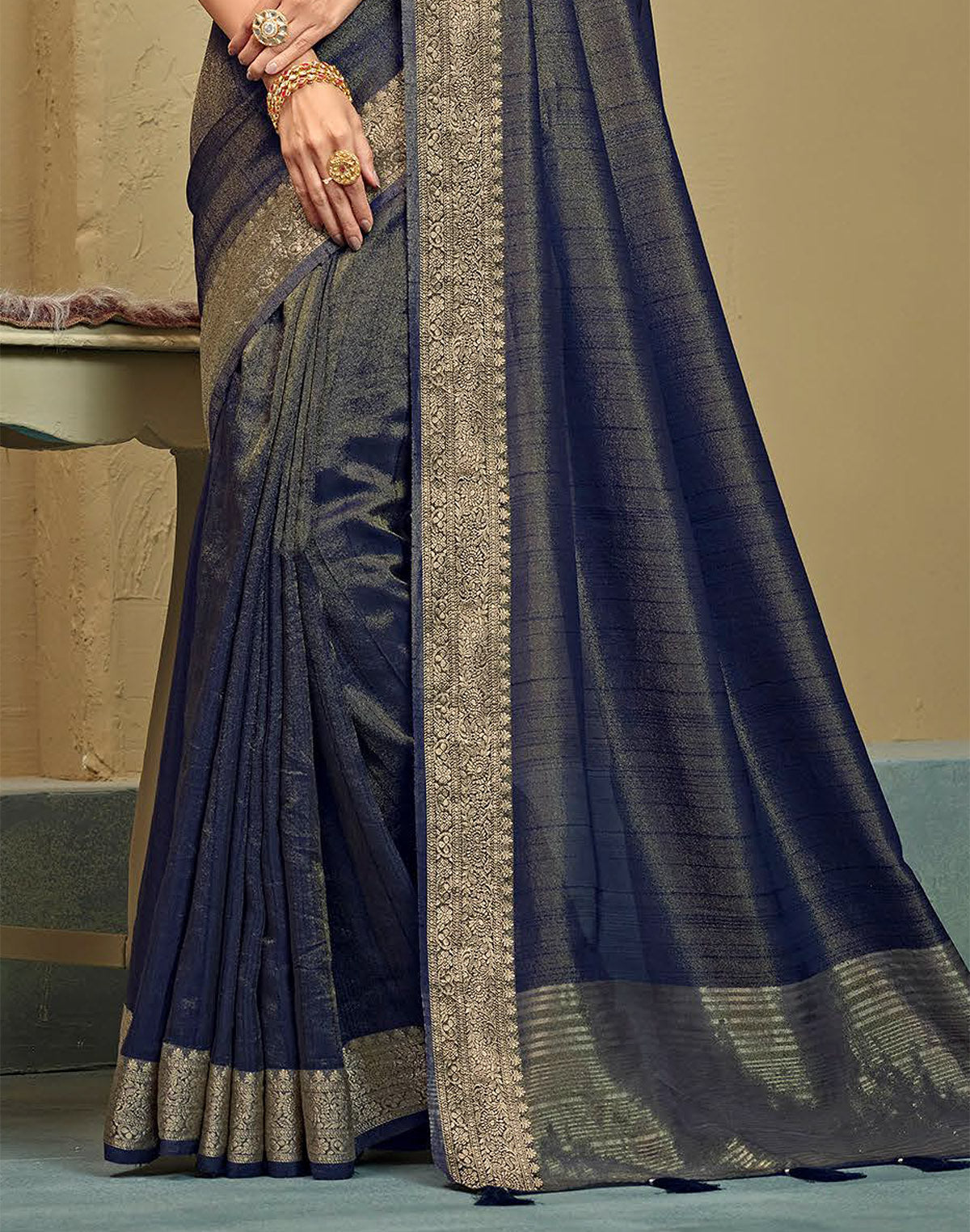 Collection of Navy Blue Raw Silk Plain Saree in a gallery layout