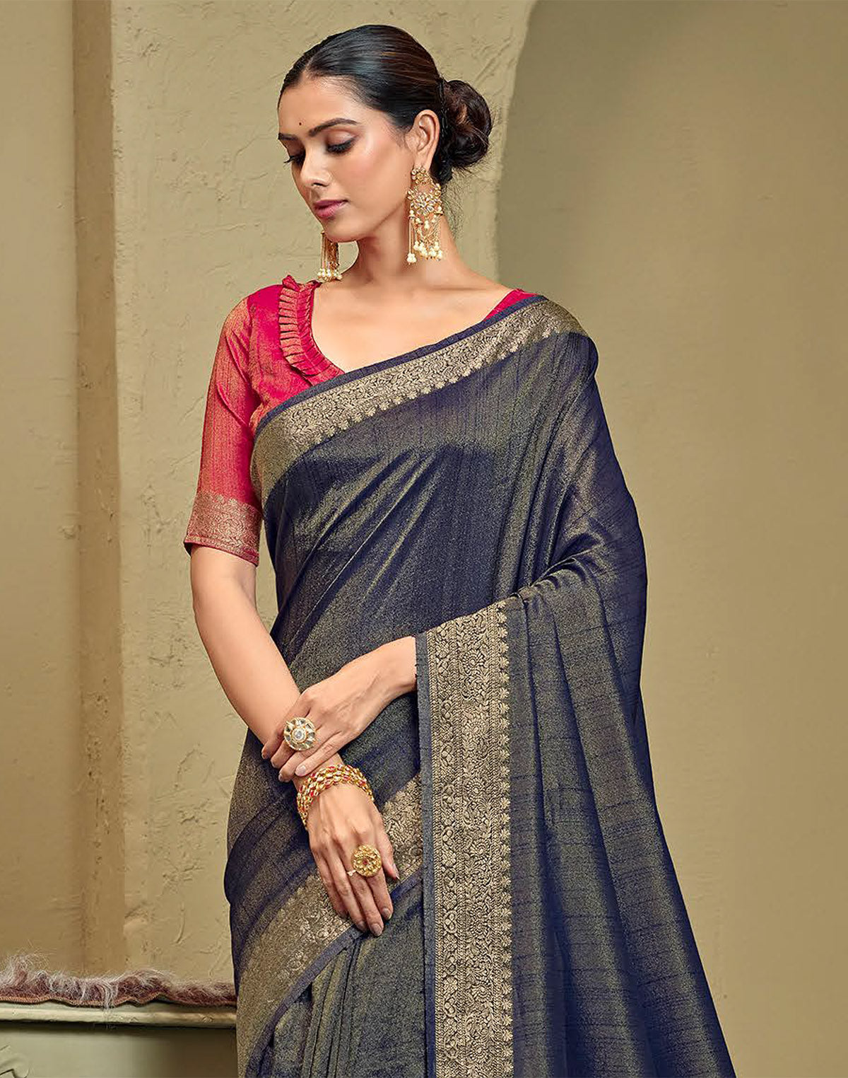 Collection of Navy Blue Raw Silk Plain Saree in a gallery layout