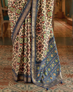 Collection of Admiral Cream Ikat Print Patola Saree in a gallery layout