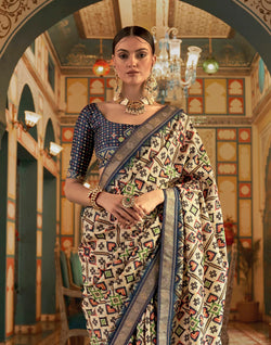 Collection of Admiral Cream Ikat Print Patola Saree in a gallery layout