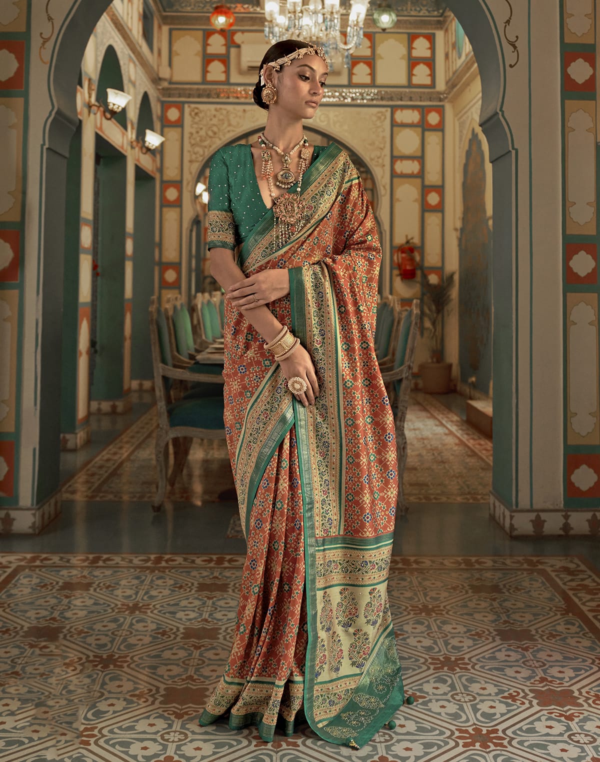 Collection of Beautiful Orange Ikat Print Patola Saree in a gallery layout