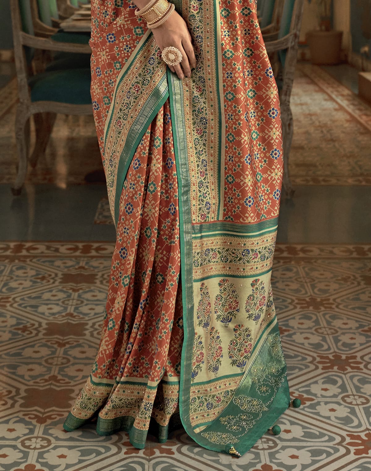 Collection of Beautiful Orange Ikat Print Patola Saree in a gallery layout