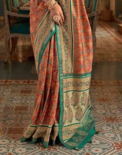 Collection of Beautiful Orange Ikat Print Patola Saree in a gallery layout