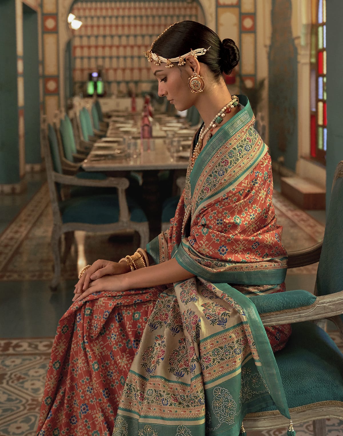 Collection of Beautiful Orange Ikat Print Patola Saree in a gallery layout