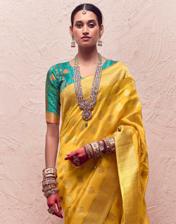 Collection of Yellow Floral Banarasi Crepe Dola Silk Saree With Designer Contrast Blouse in a gallery layout