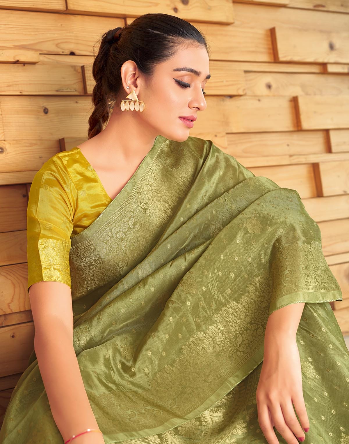 Collection of Olive Green Semi Crape Embellished work Saree in a gallery layout