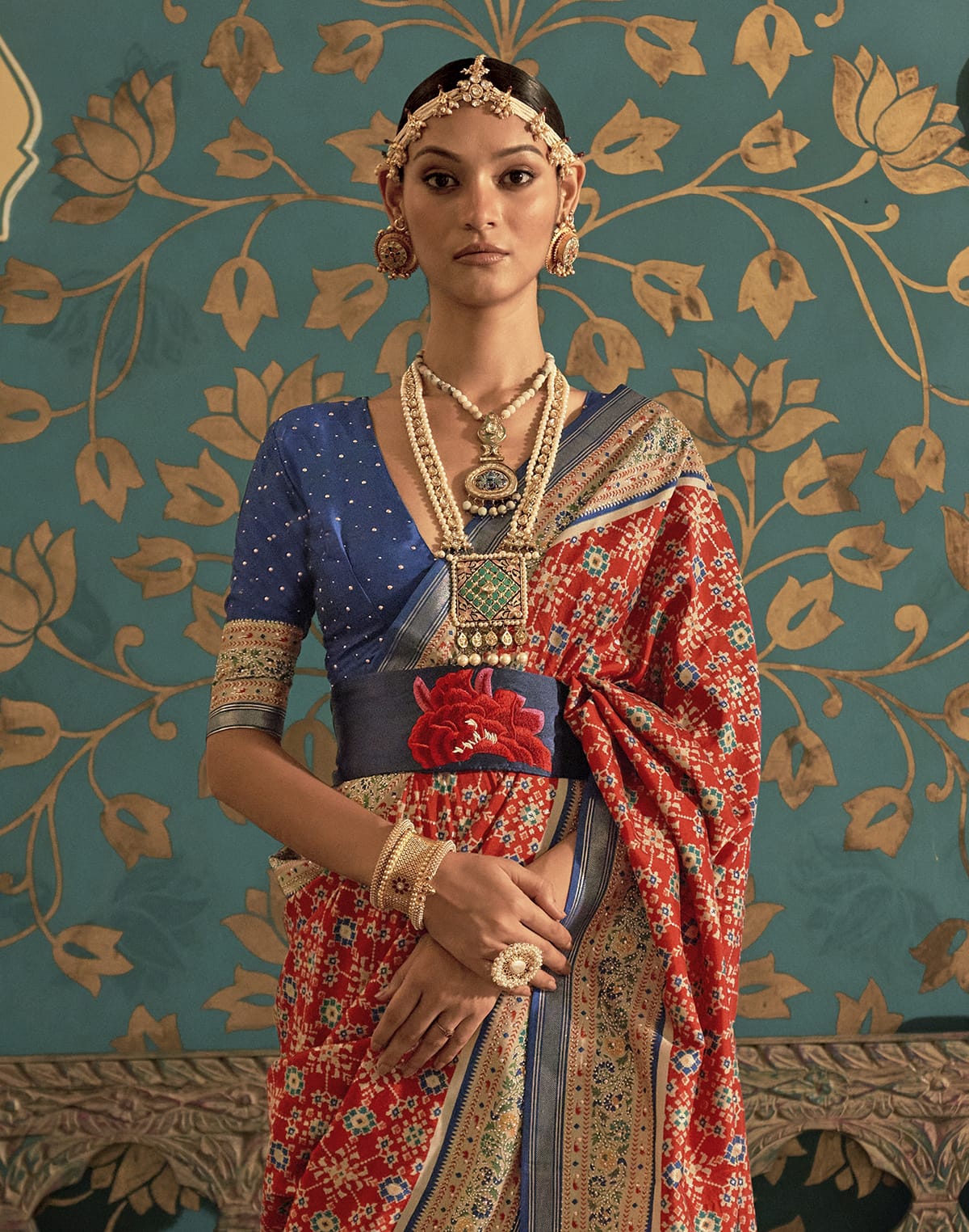 Collection of Dark Orange Ikat Print Soft Patola Silk Saree in a gallery layout