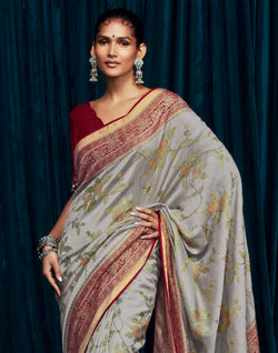 Collection of Light Grey Floral Brasso Silk Saree With Red Coloured Designer Blouse in a gallery layout