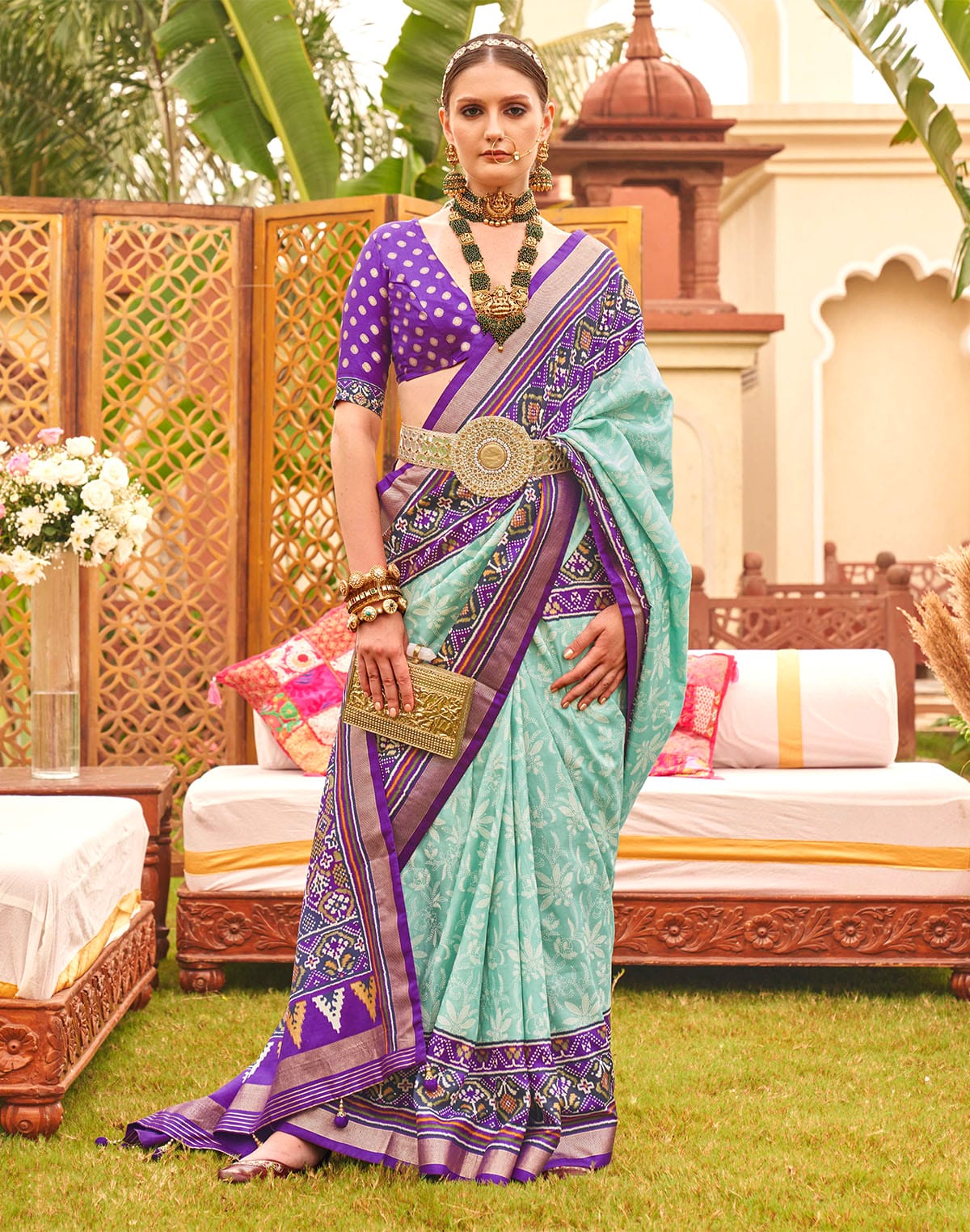 Collection of Alluring Sea Green smooth Patola Saree in a gallery layout