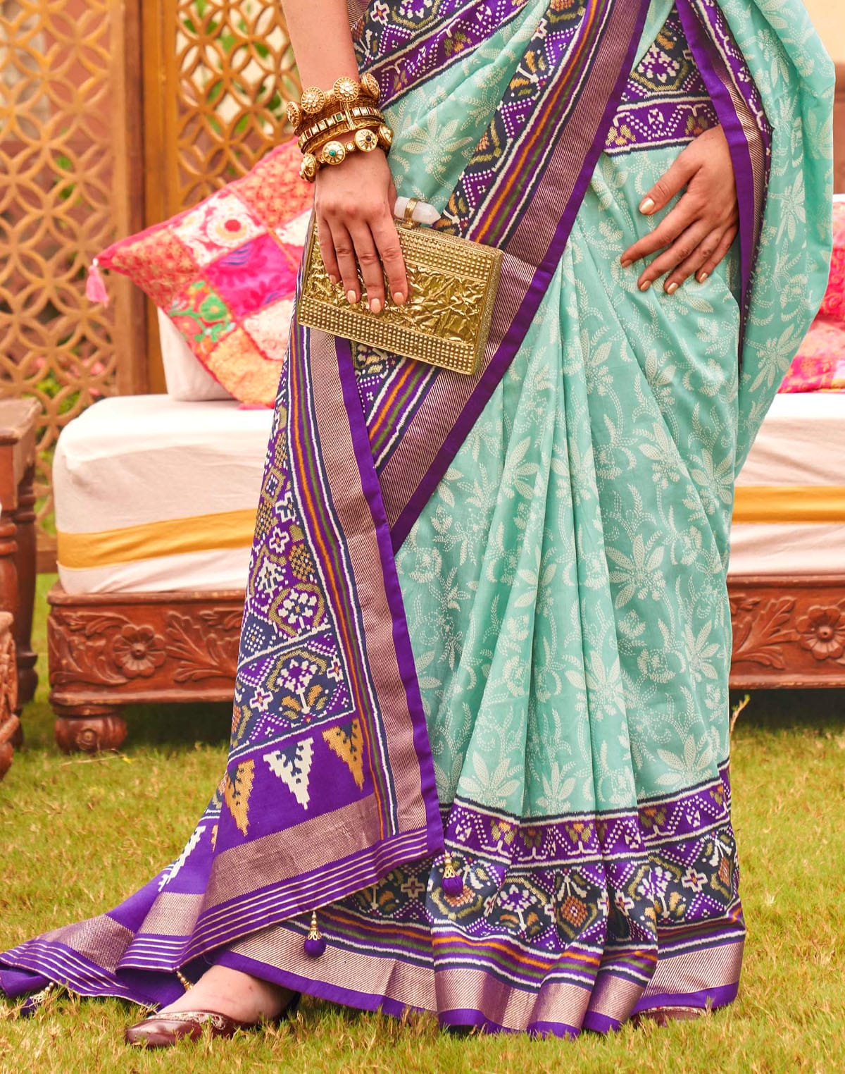 Collection of Alluring Sea Green smooth Patola Saree in a gallery layout