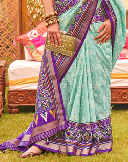 Collection of Alluring Sea Green smooth Patola Saree in a gallery layout