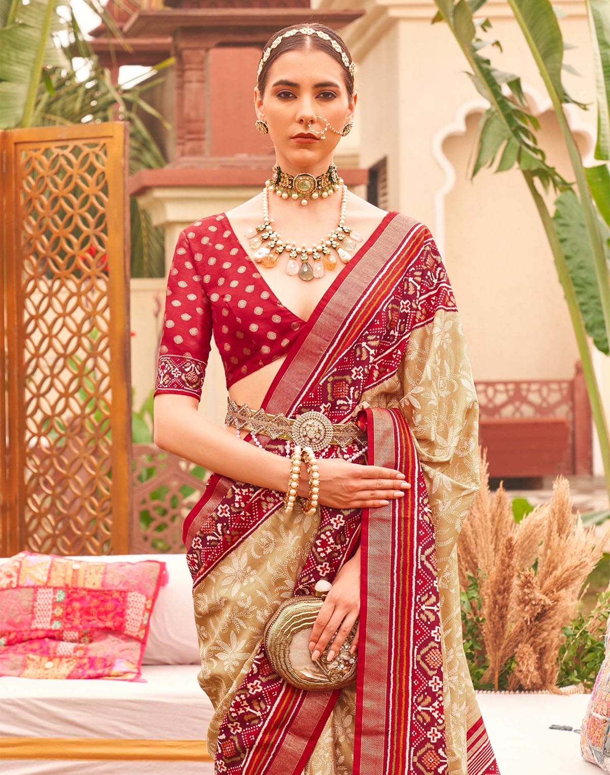 Collection of Cream and Red Floral Patola Silk Designer Saree in a gallery layout