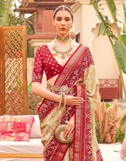 Collection of Cream and Red Floral Patola Silk Designer Saree in a gallery layout