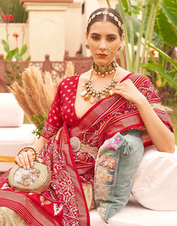 Collection of Cream and Red Floral Patola Silk Designer Saree in a gallery layout