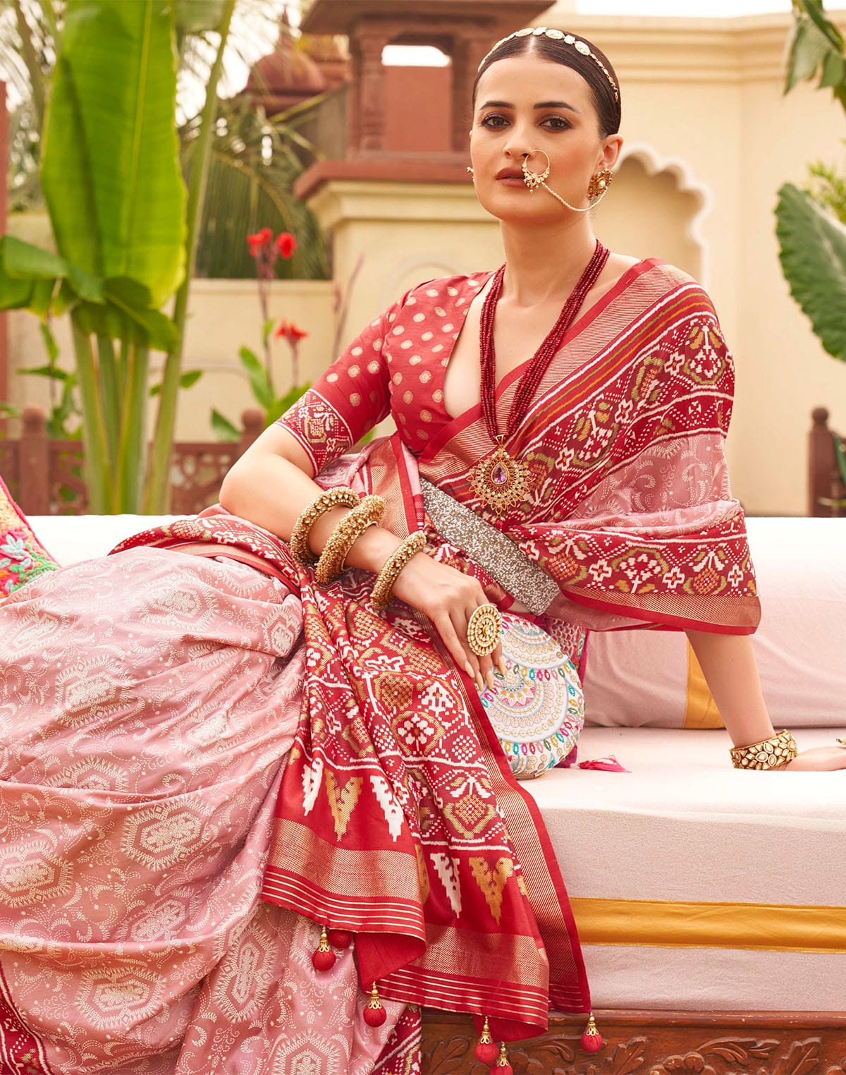 Collection of Precious Pink Patola Print Traditional Saree in a gallery layout