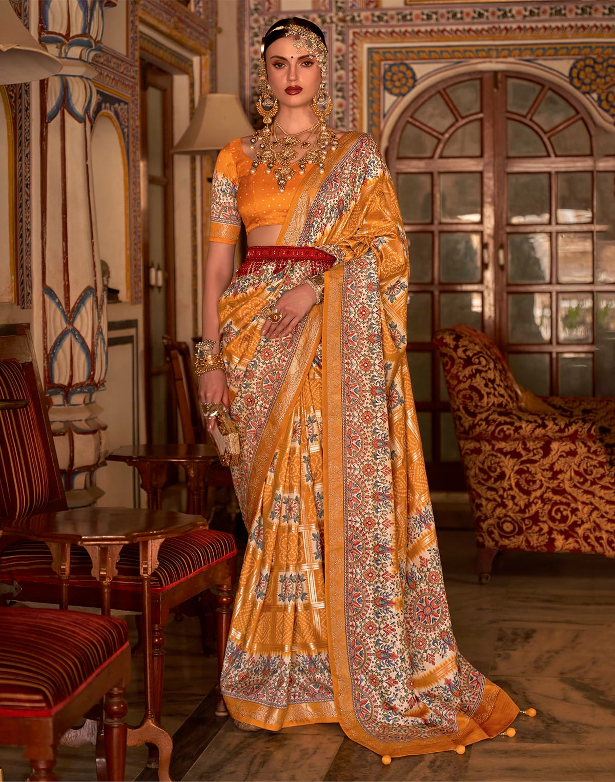 Collection of Mustard Bandhini Print smooth Patola Silk Saree in a gallery layout