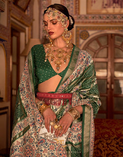 Collection of Green all over beautiful Bandhini Print Patola Saree in a gallery layout