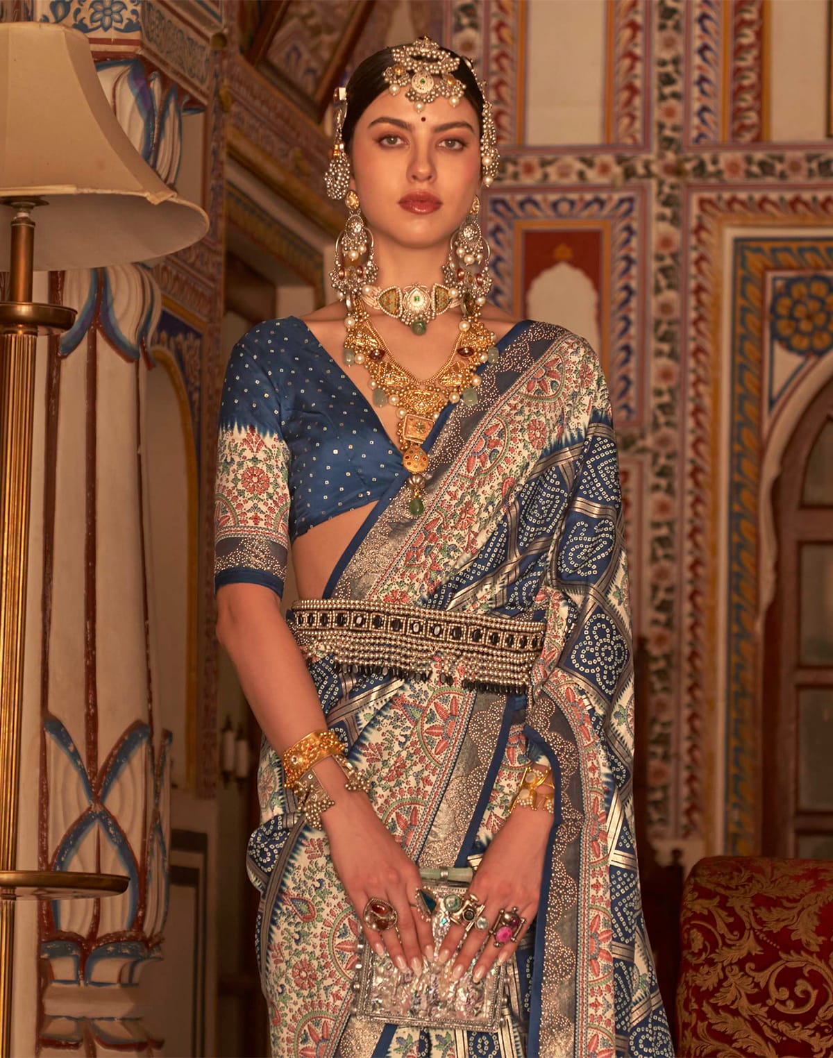 Collection of Peacock Blue Patola Silk Bandhini Print Saree in a gallery layout