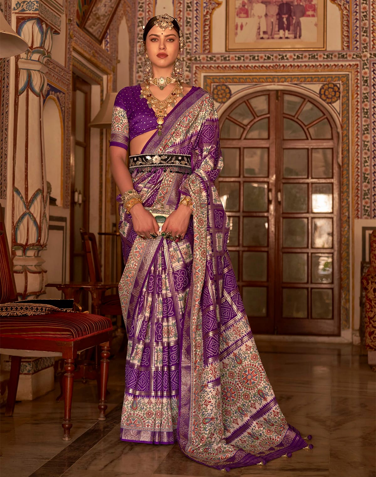 Collection of Elegant Purple Colour Patola Silk Designer Saree in a gallery layout