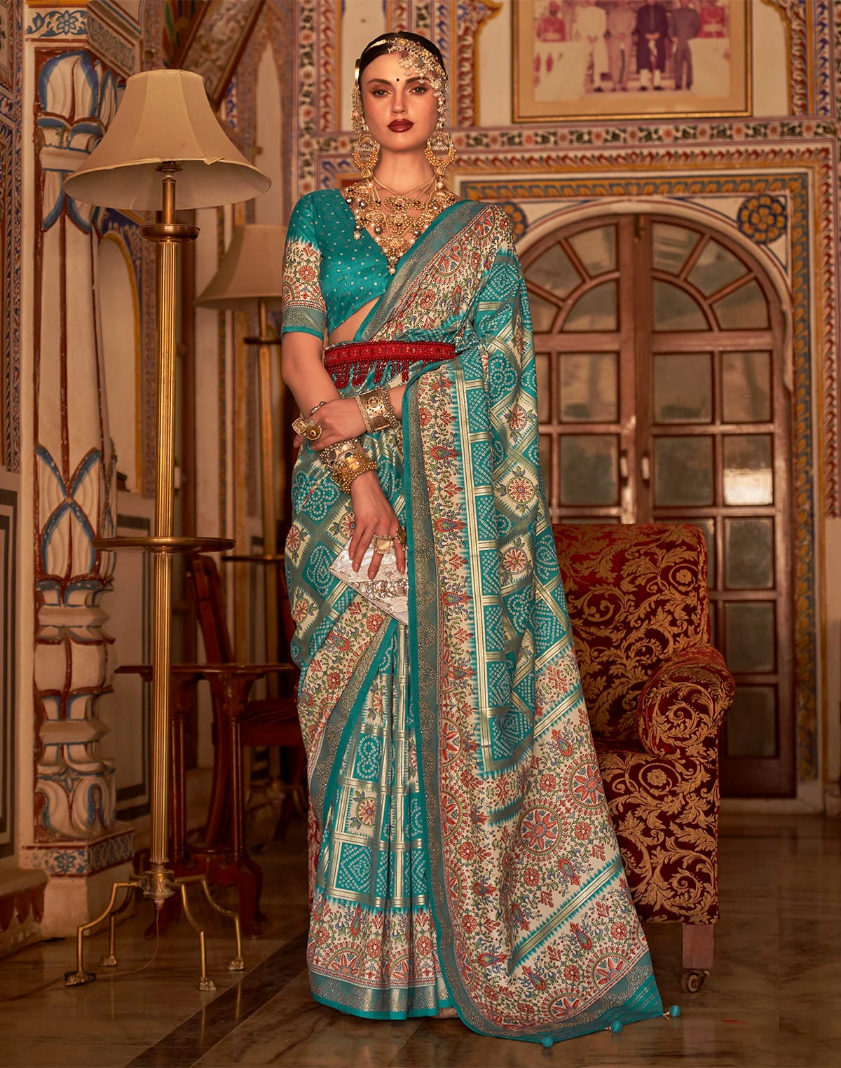 Collection of Sea Green Designer Patola Silk Bandhini Saree in a gallery layout