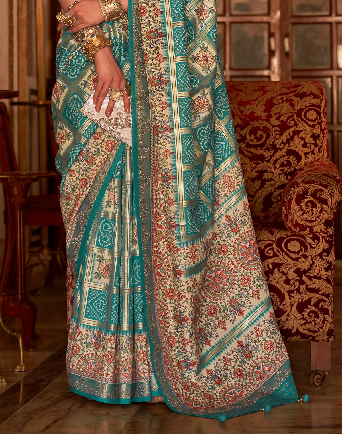 Collection of Sea Green Designer Patola Silk Bandhini Saree in a gallery layout