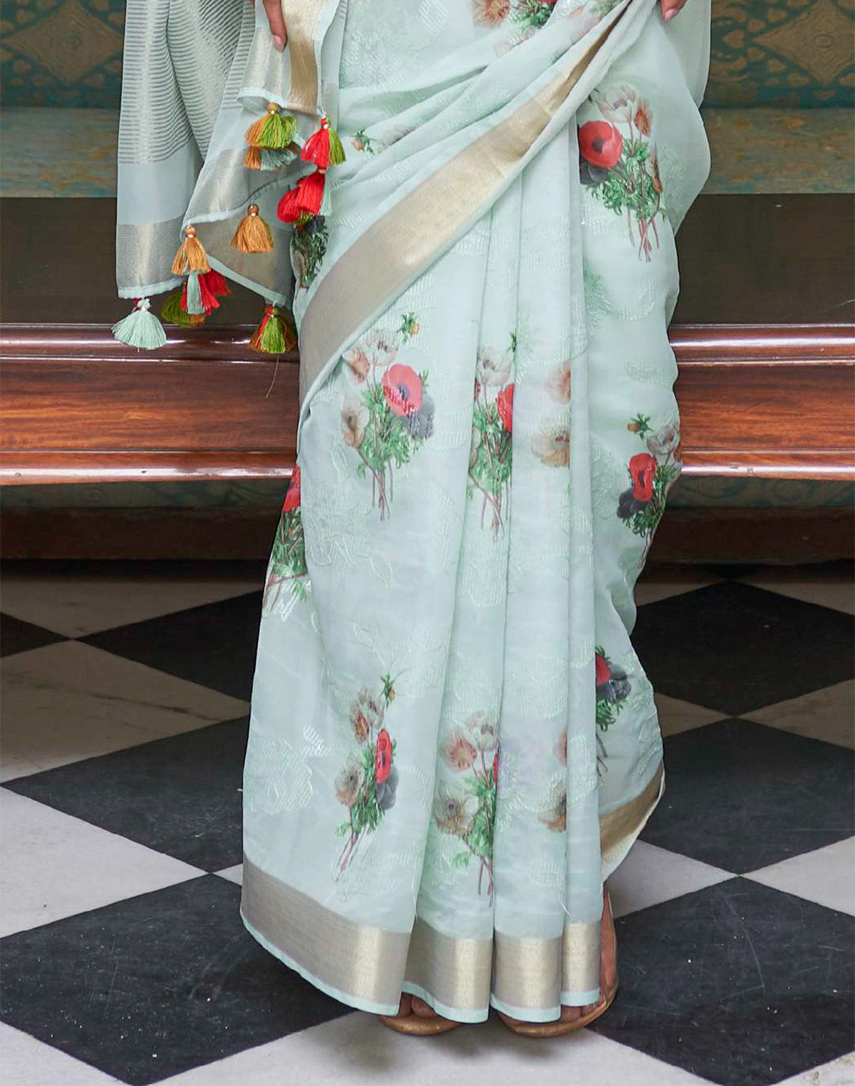 Collection of Light Blue Floral Print Organza Saree and Green Colored Blouse in a gallery layout