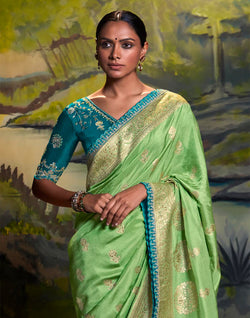 Collection of Pista Green Pure Dola Silk Saree With Designer Blue Embroidery Work Blouse in a gallery layout