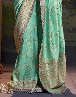 Collection of Sea Green Pure Dola Silk Saree With Fancy Lace Border and Embroidery Work Blouse in a gallery layout