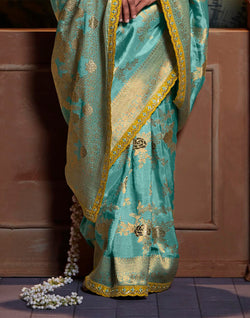 Collection of Aqua Blue Pure Dola Silk Floral Saree With Fancy Lace Border and Embroidery Work Blouse in a gallery layout