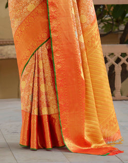 Collection of Orange and Green Floral Design Pure Silk Saree With Self Border in a gallery layout