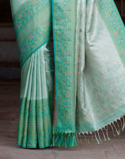 Collection of Sea Green Self Design Kanchipuram Pure Silk Saree in a gallery layout