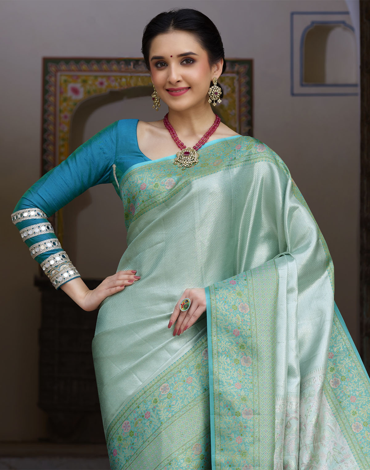 Collection of Sea Green Self Design Kanchipuram Pure Silk Saree in a gallery layout