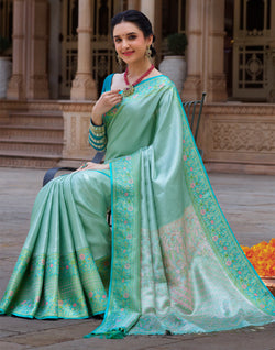 Collection of Sea Green Self Design Kanchipuram Pure Silk Saree in a gallery layout