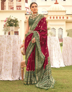 Collection of Maroon Coloured Patola Contrast Saree in a gallery layout