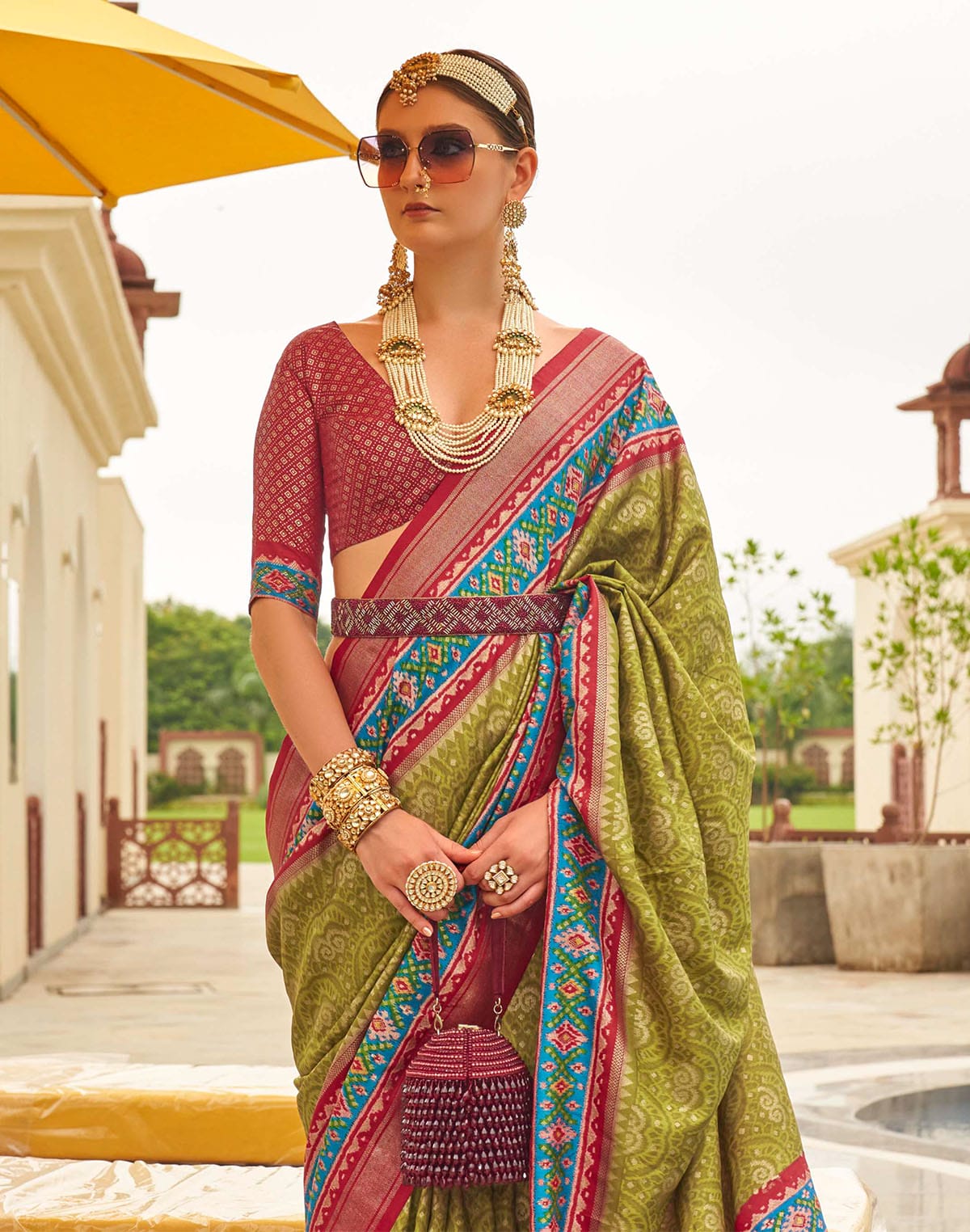 Collection of Patola Silk Fabric Mehendi Green Contrast Saree in a gallery layout